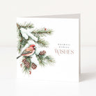 A white greeting card standing upright on a light surface, featuring a watercolor-style winter branch with snow, pinecones, a red finch bird, and the text 'warmest winter WISHES'.