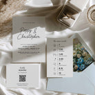 Modern wedding invitation suite with invitation card, itinerary card with icons and timings, plus a QR code RSVP card, alongside a pale blue envelope with blue floral envelope liner.