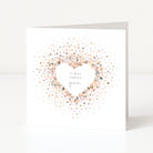 Greeting card with heart confetti design and text on a white background