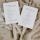 calligraphy wedding programme paddle fan with wooden handle on a neutral background
