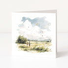 Art print of two people flying a kite in a field with a blue sky.