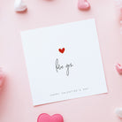 Valentine's Day card with 'love you' and heart design on a pink background