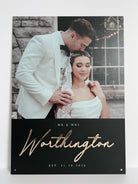 Wedding photo on black acrylic of a couple with 'MR & MRS Worthington' gold text on a black background