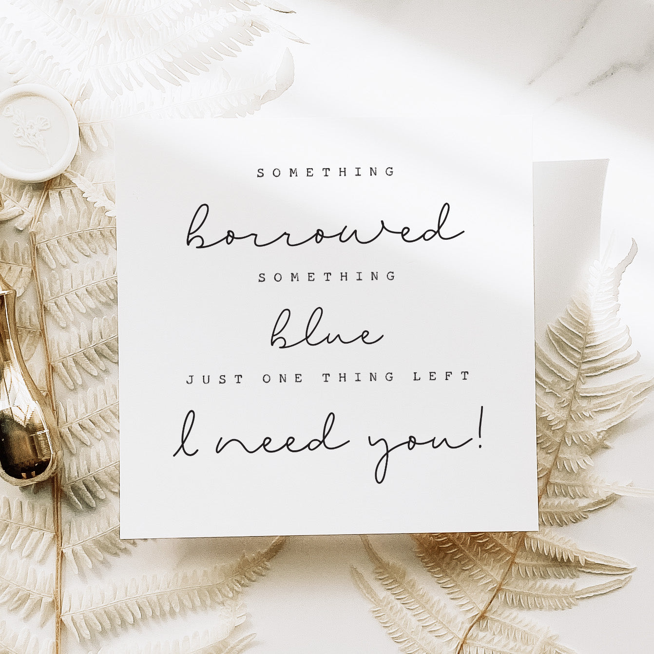 Card with wedding-themed text surrounded by decorative elements on a light background