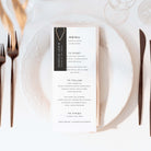 Wedding Menu card on a white plate with cutlery and black name tag