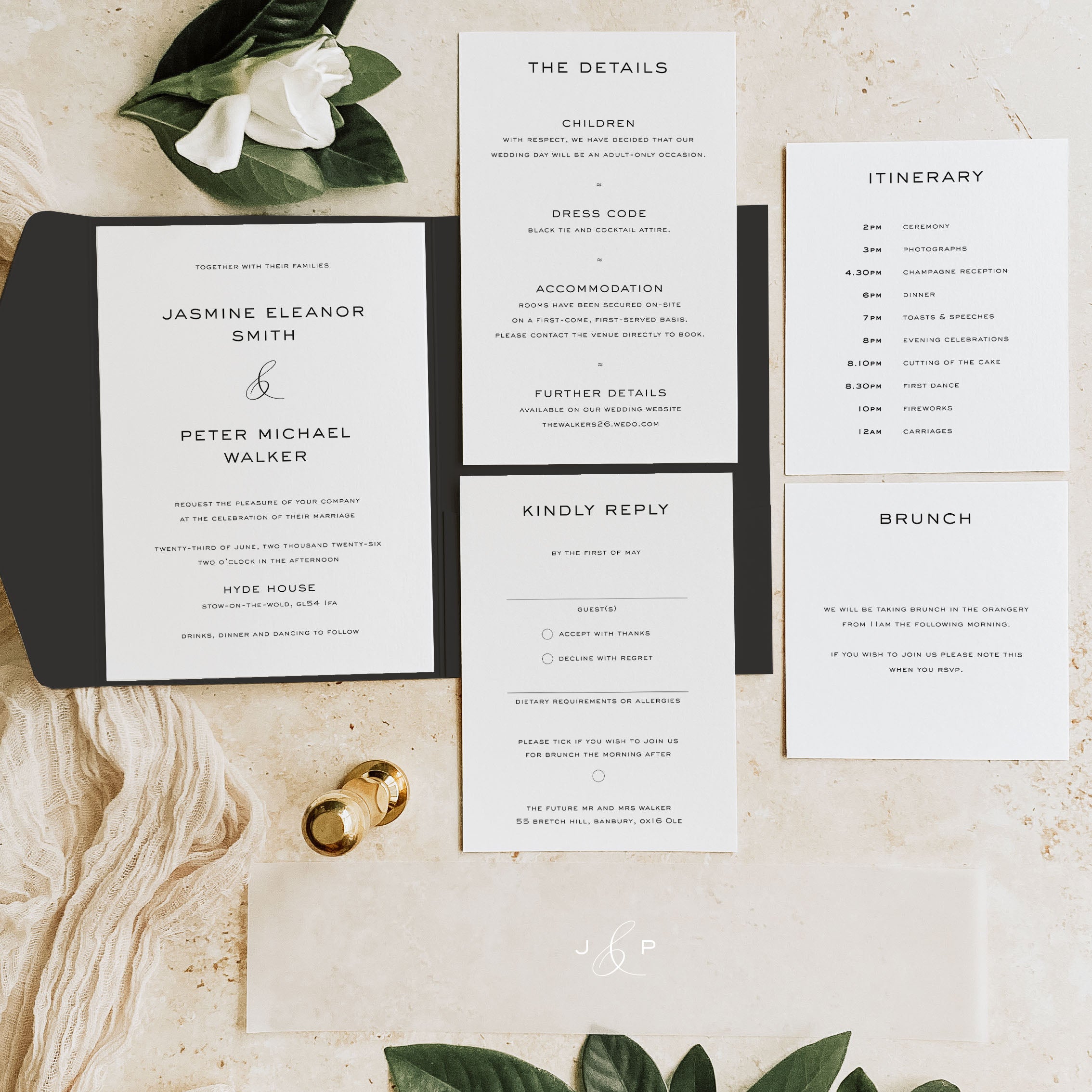 Wedding invitation set with details on a wooden surface