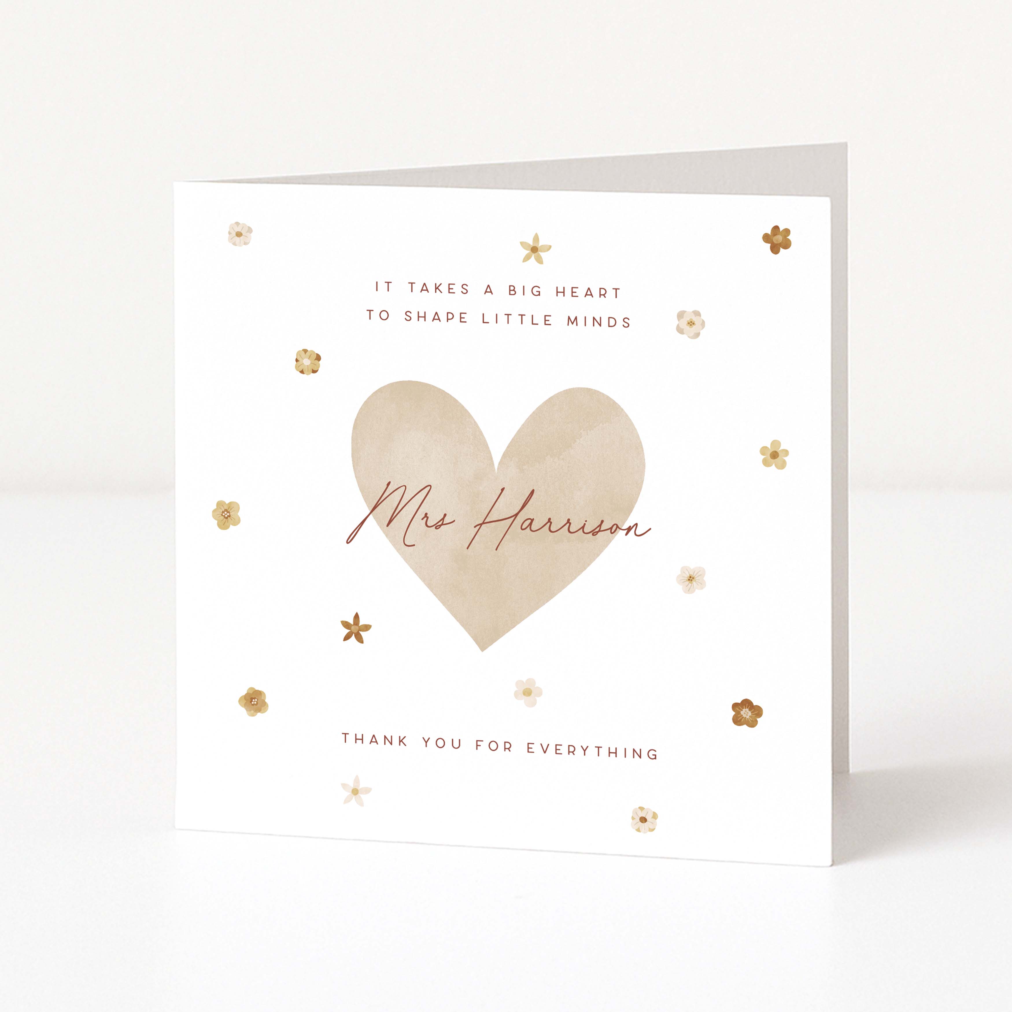 white card with beige heart and teachers name in centre