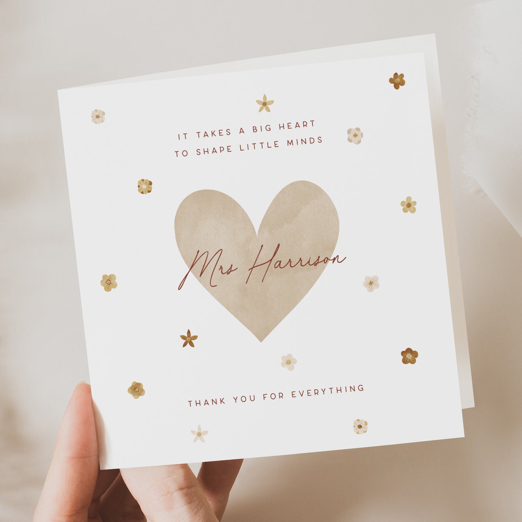 hand hold white card with neutral design for teacher