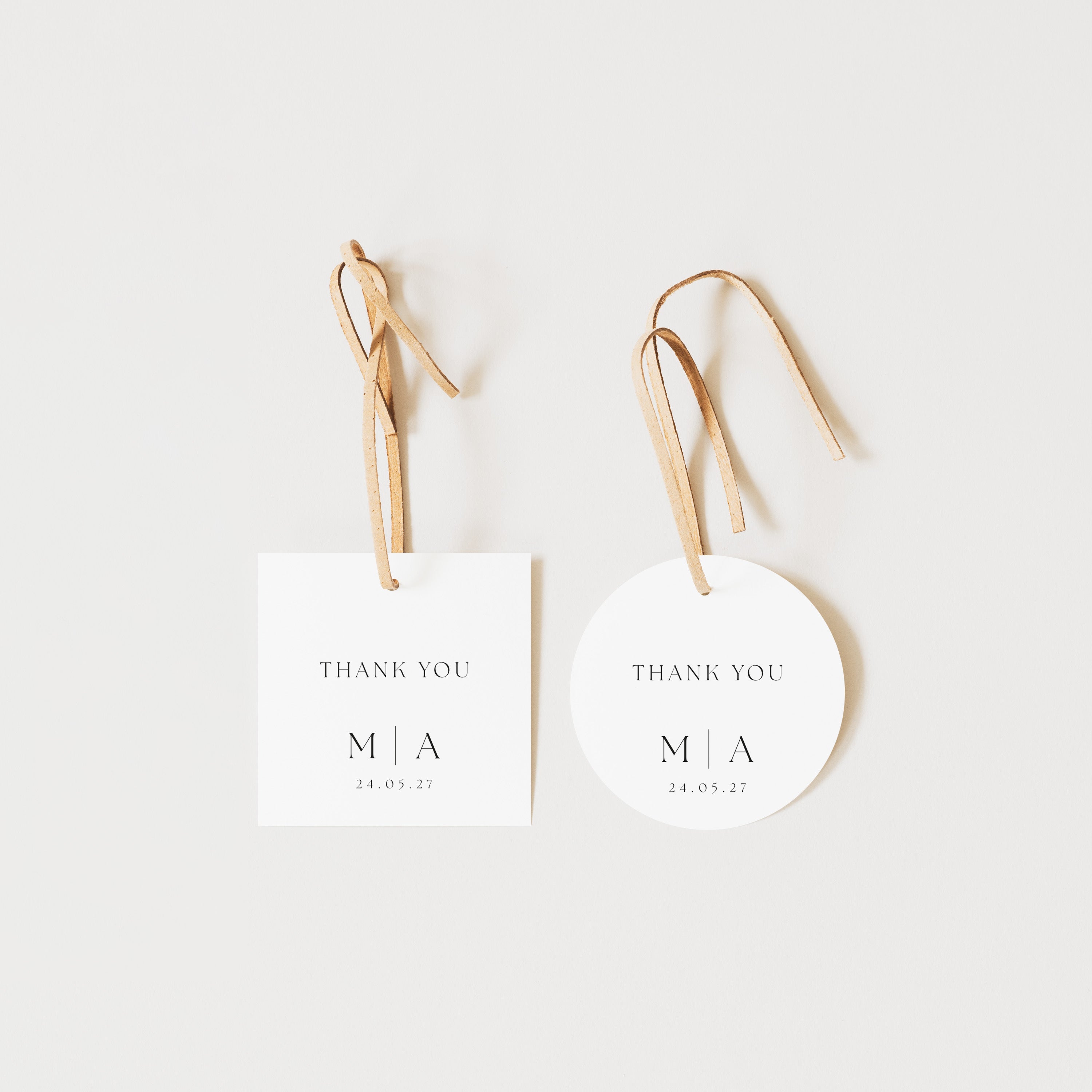 Two 'Thank You' cards with initials and date on a white background
