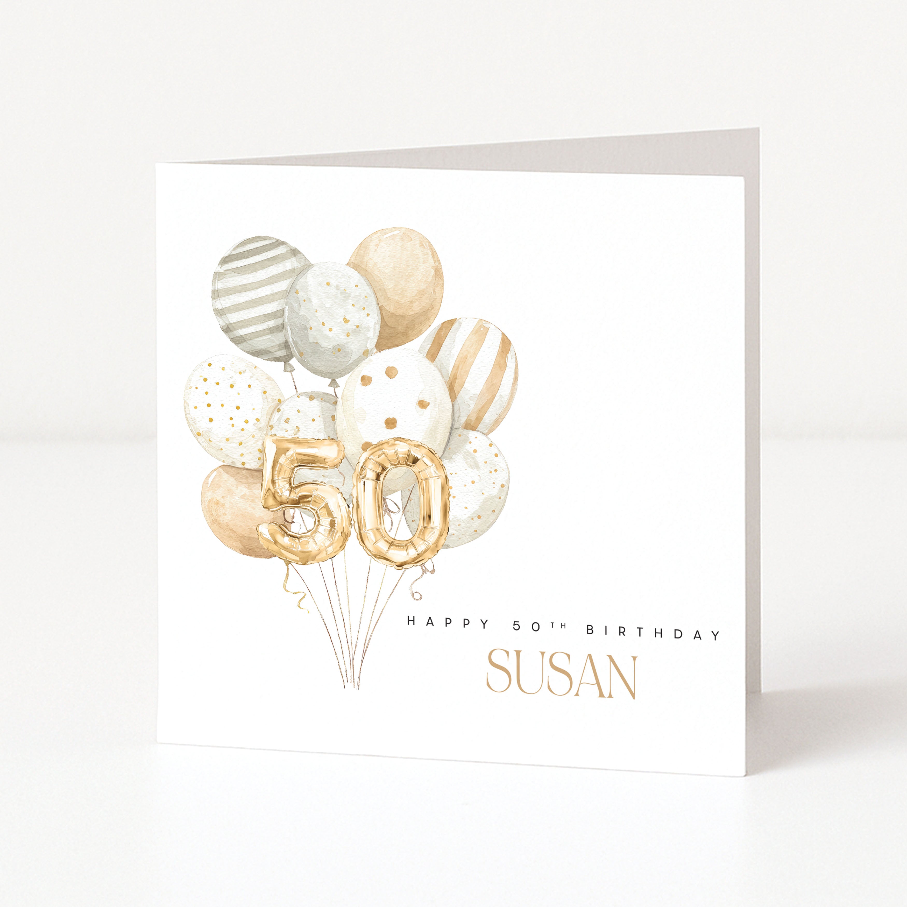Personalised square 50th birthday card for her featuring a neutral cream and gold watercolour balloon cluster topped with gold foil balloon numbers fifty, and customisable front name text.