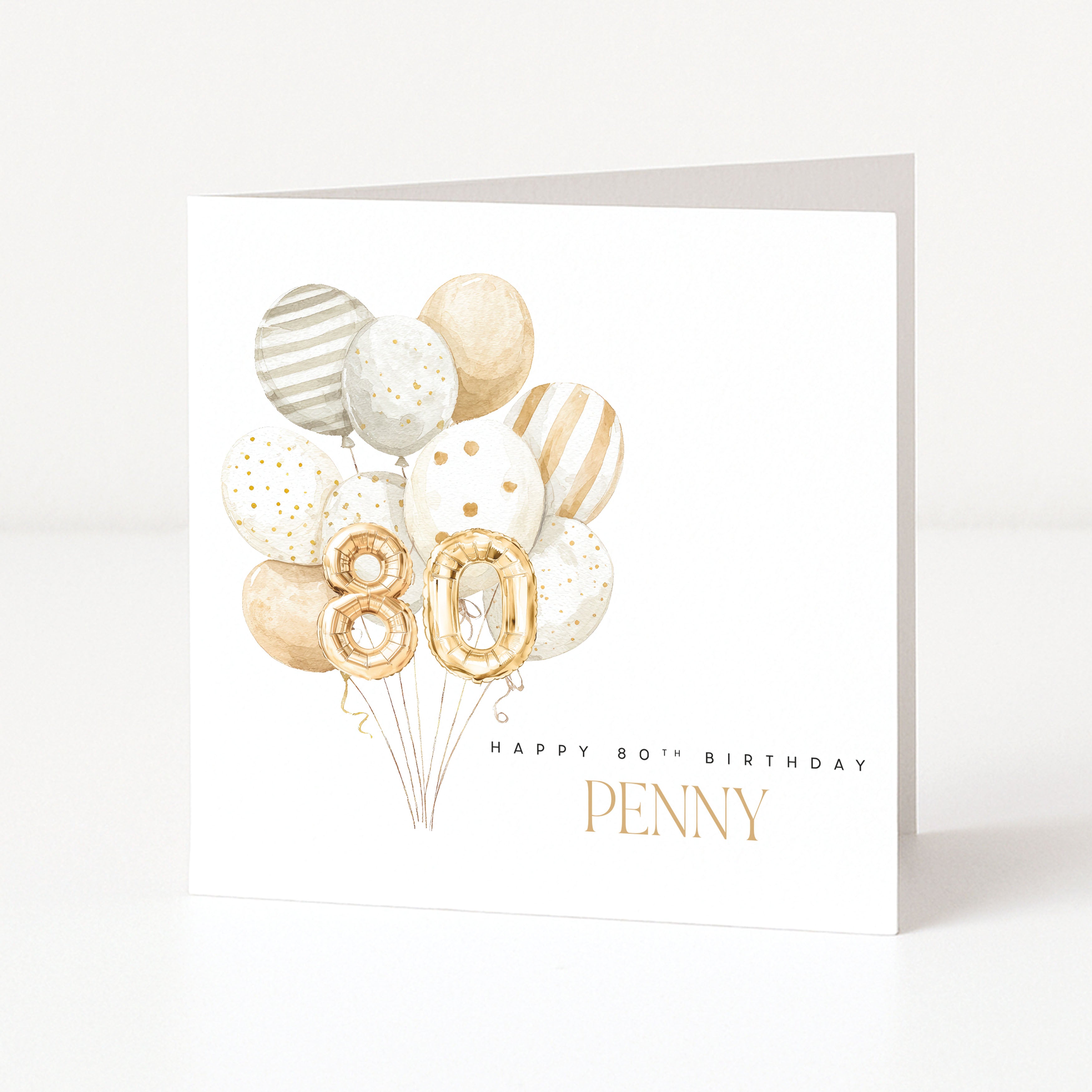 Personalised 80th birthday card for Penny with gold 80 balloons and a soft neutral balloon arrangement.