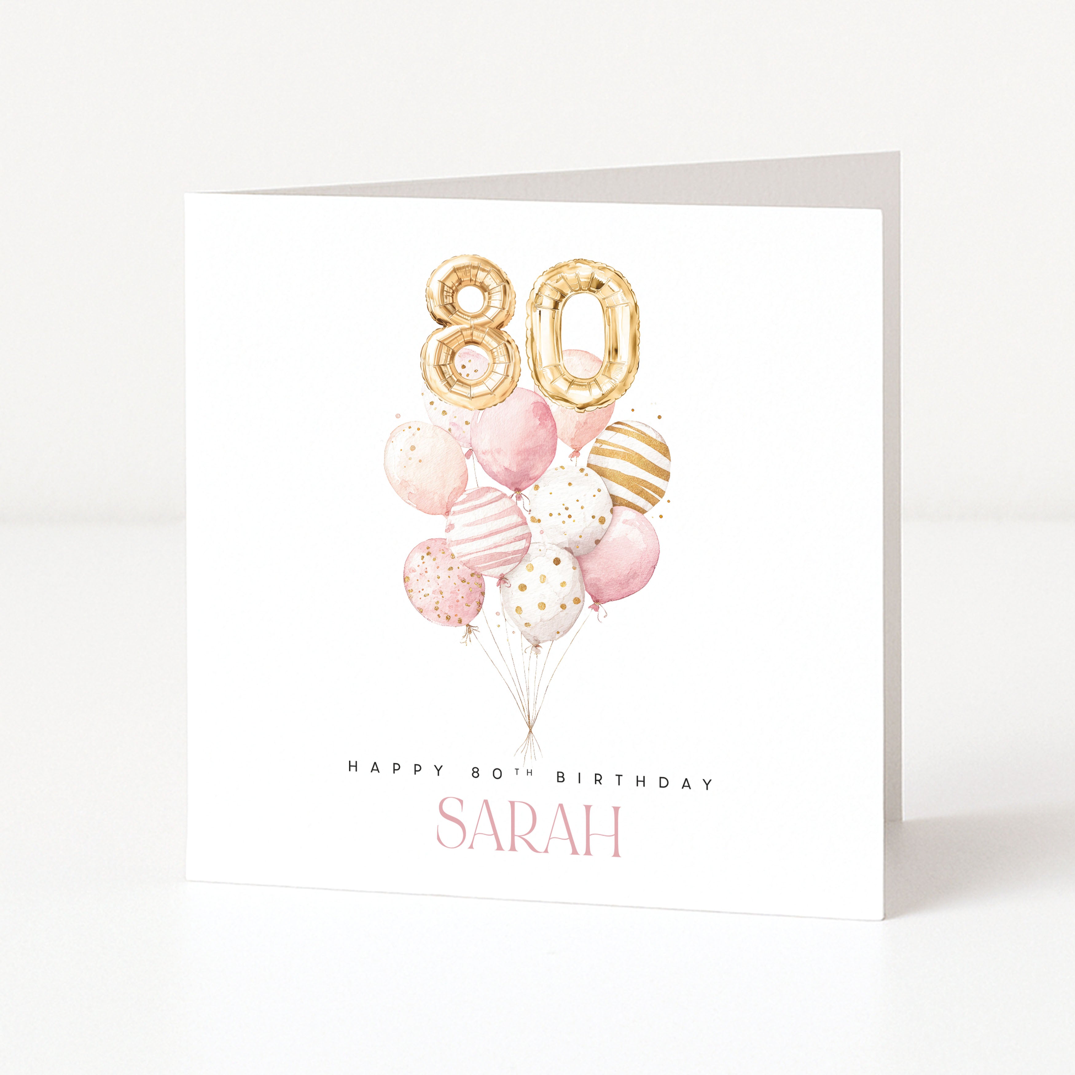 Personalised 80th birthday card for Sarah with gold 80 balloons and a pink watercolour balloon bouquet.