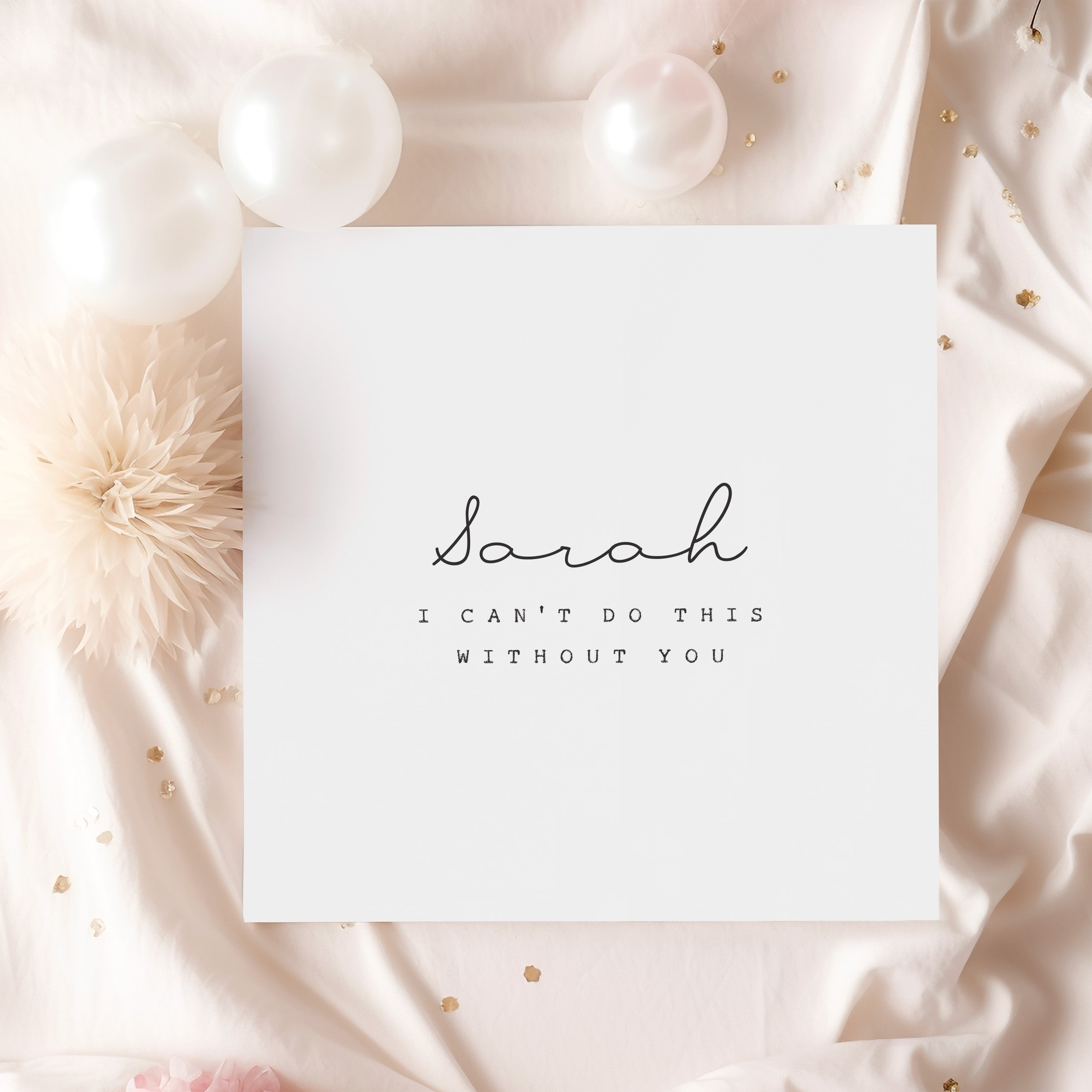 Card with 'Sarah, I can't do this without you' text on a soft pink background with decorative elements.
