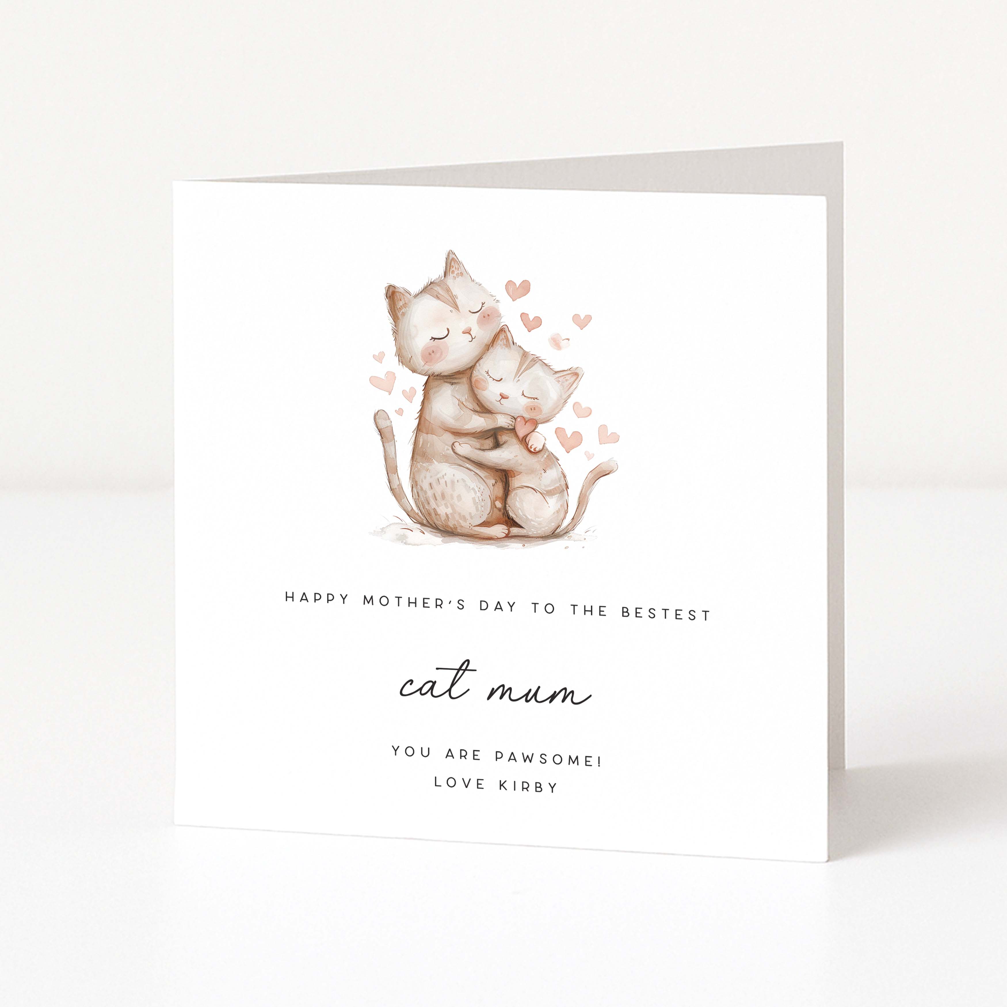 Greeting card with two cats hugging and hearts, text 'Happy Mother's Day to the bestest cat mum', on a white background.