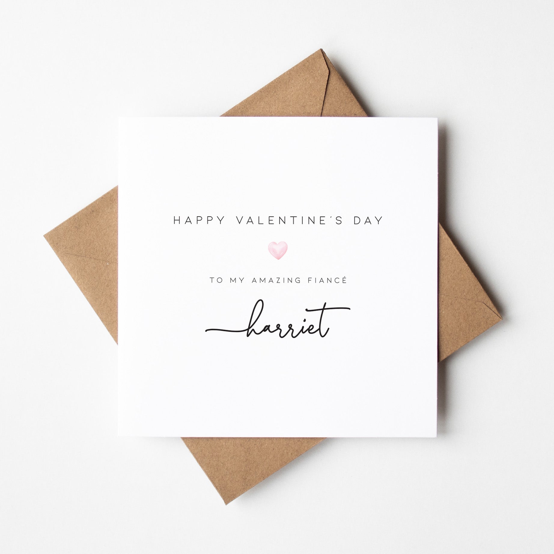Valentine's Day card with 'Happy Valentine's Day to my amazing fiance Harriet' text on a white background.
