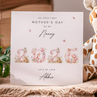 Greeting card for Mother's Day with '2025' and floral elements, placed on a textured surface with a giraffe toy.