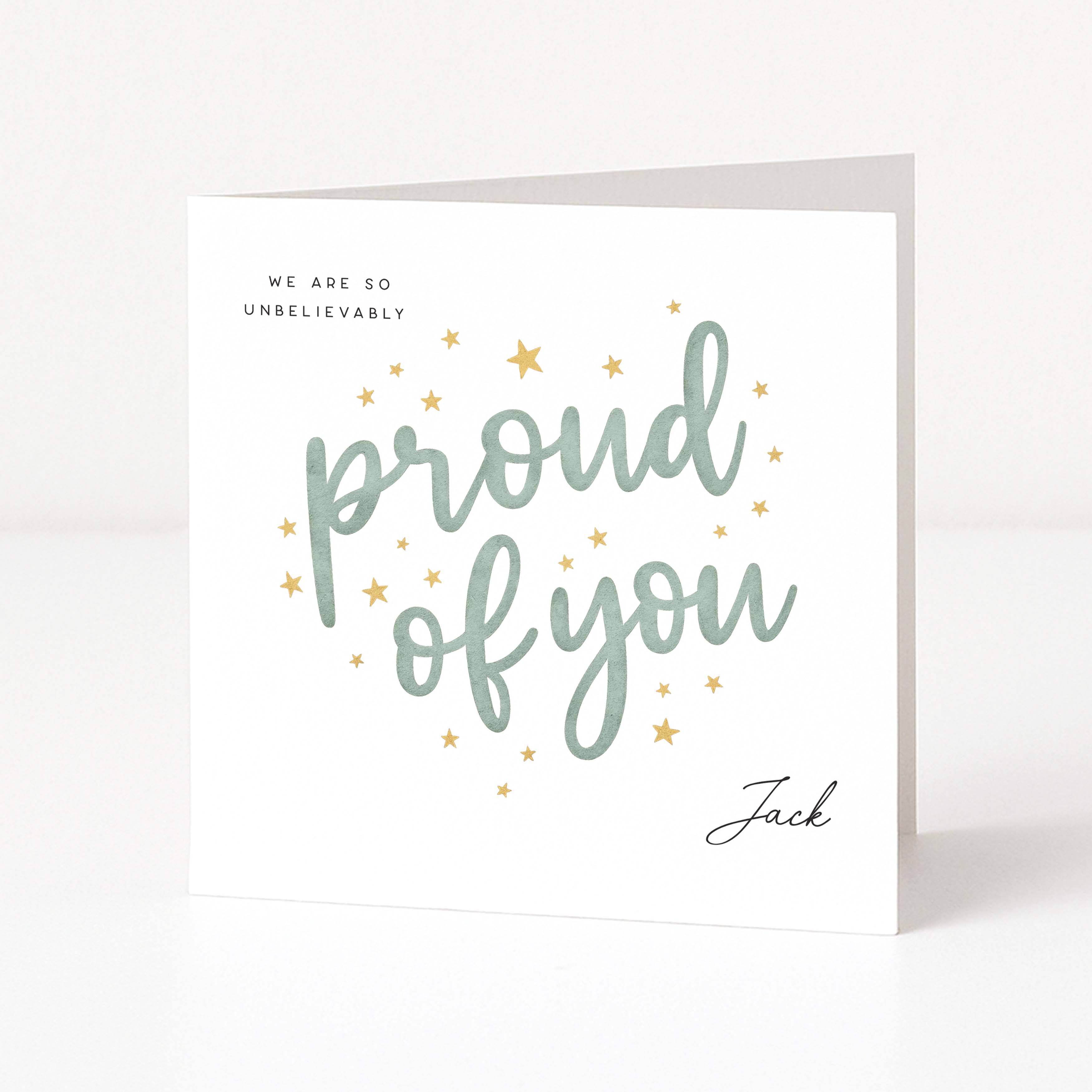 Greeting card with 'proud of you' text on a white background