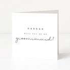 Greeting card asking 'Hannah, will you be my groomsmaid?' on a white background