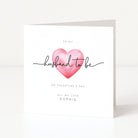 Greeting card with a pink heart and text on a white background