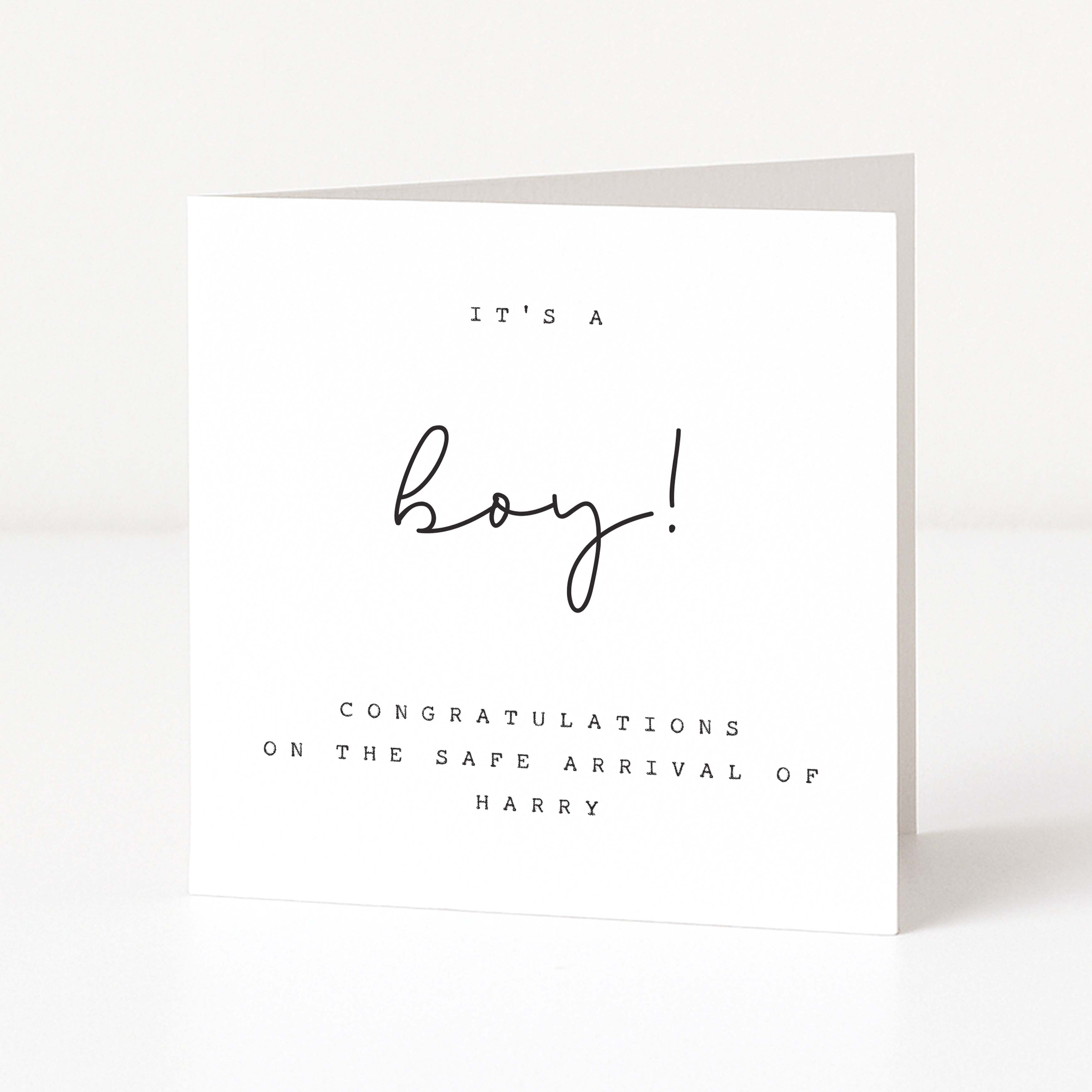 White card with black text celebrating the safe arrival of a boy