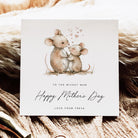 Mother's Day card with two mice hugging and hearts, on a textured fabric background.