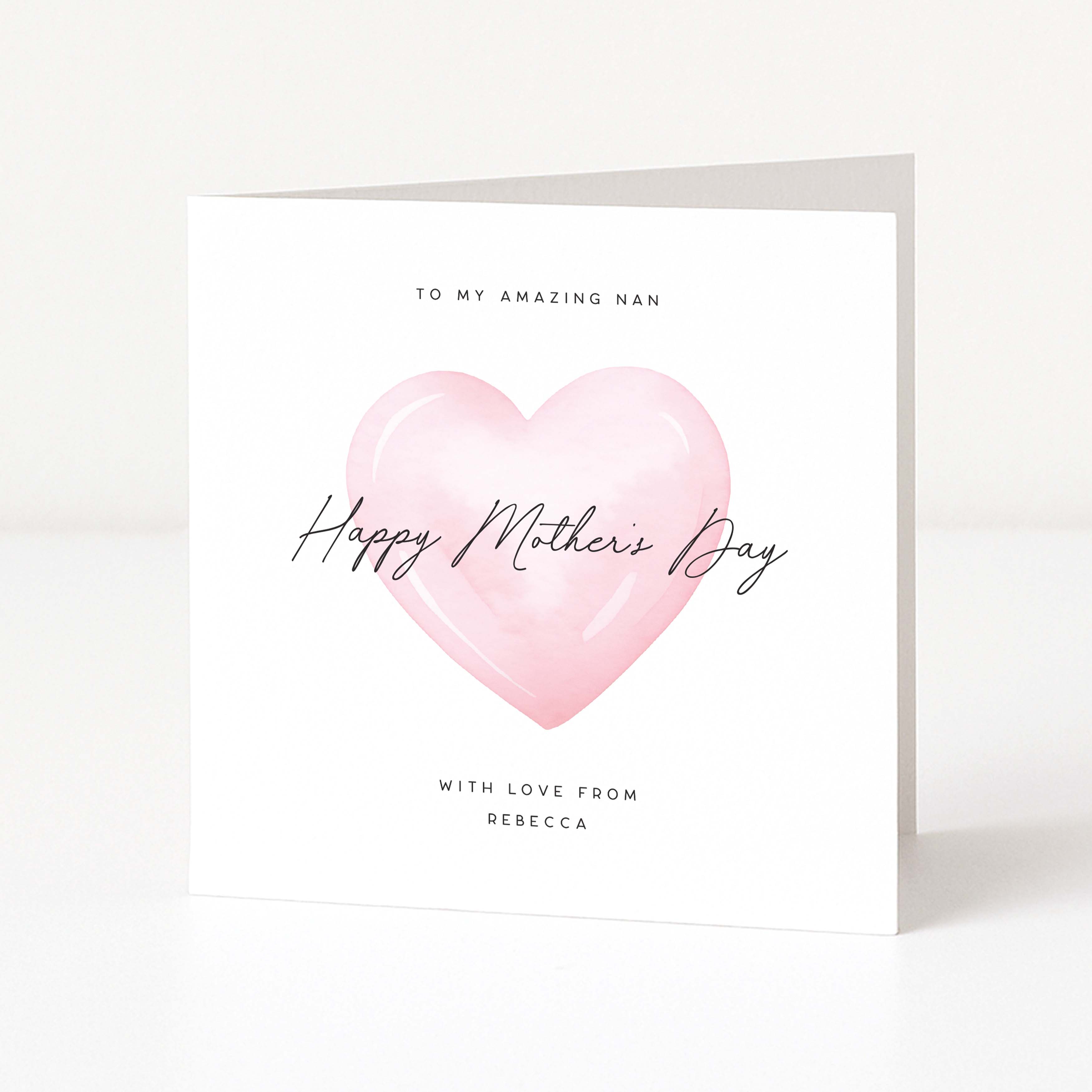 Greeting card with pink heart and 'Happy Mother's Day' text on a white background