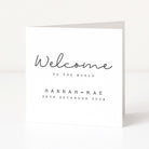 White card with 'Welcome to the World' text on a white background