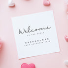 White card with 'Welcome to the World' text on a pink background