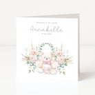Greeting card with teddy bear and floral design, featuring text 'Welcome to the world Annabelle 17.07.2026'.