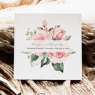 Wedding invitation card with floral design on a textured surface