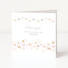 Valentine's Day card with heart designs and personalized text on a white background