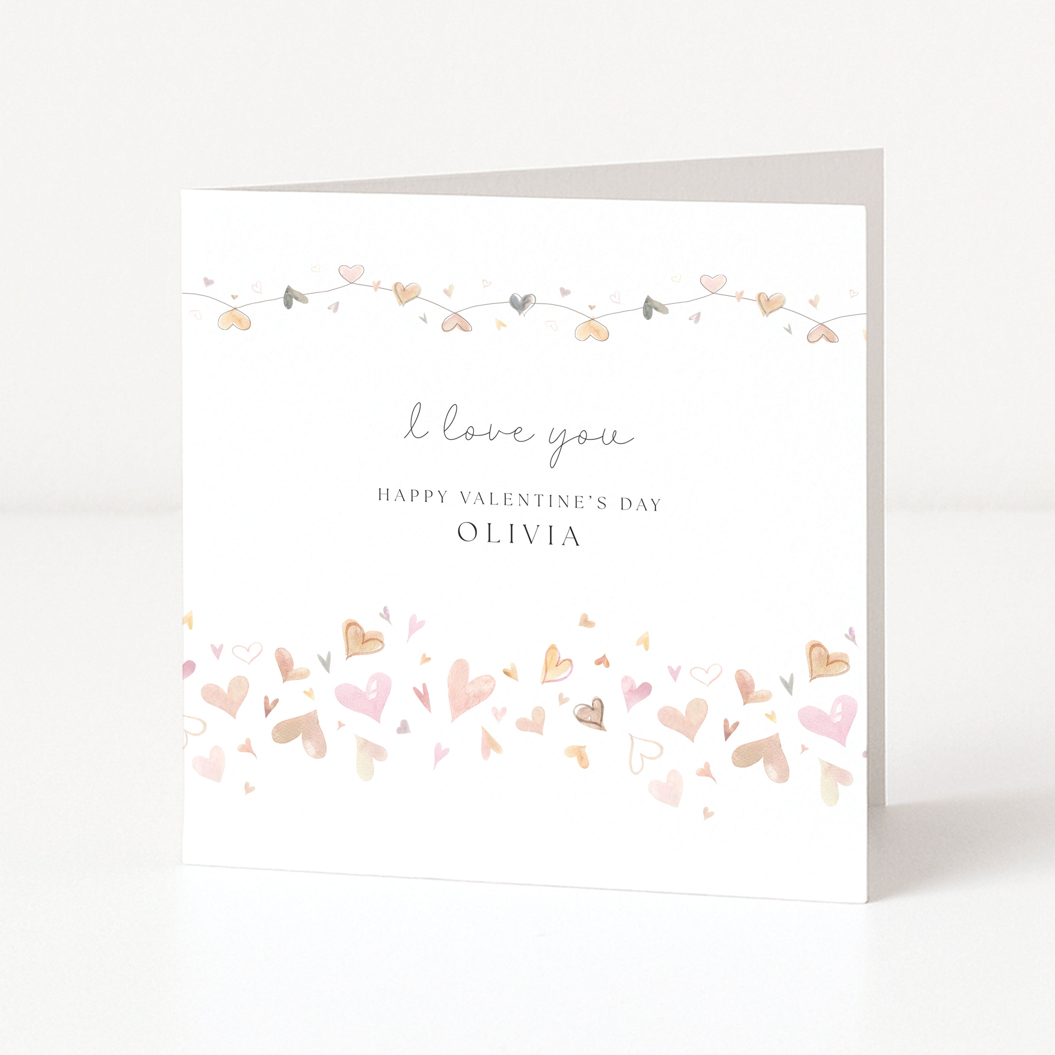 Valentine's Day card with heart designs and personalized text on a white background