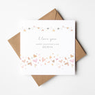 Valentine's Day card with 'I love you' and 'Happy Valentine's Day Olivia' text, surrounded by decorative hearts on a white background.