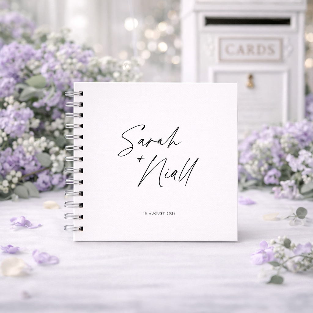 Personalized guestbook with 'Sarah & Niall' on a decorative background with flowers