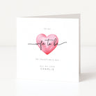 Greeting card with a pink heart and text on a white background