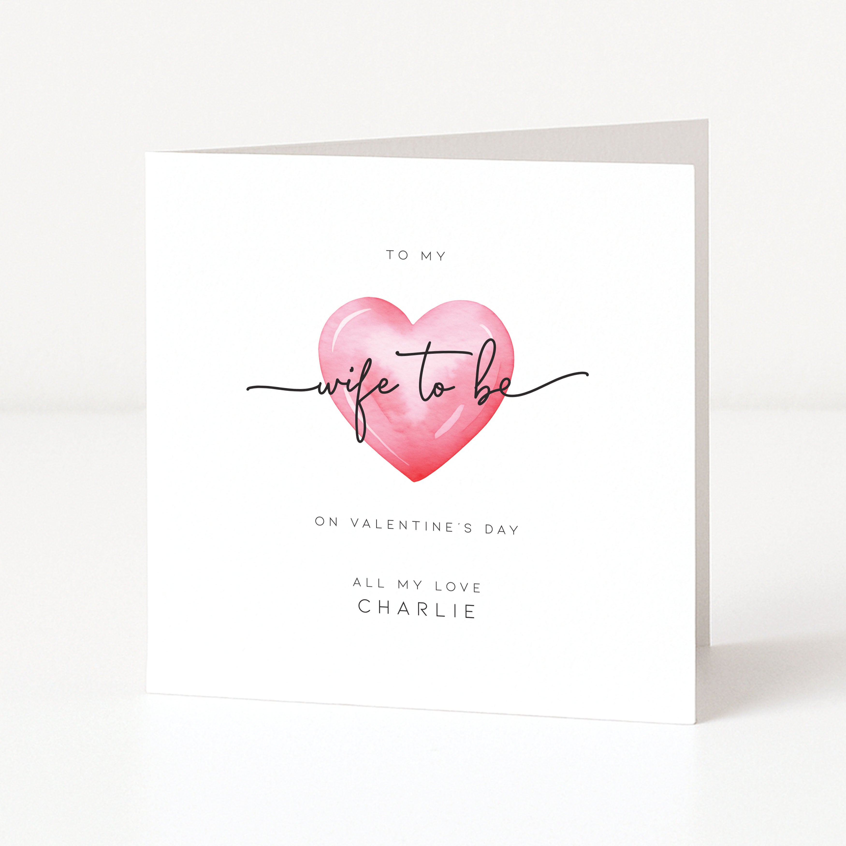 Greeting card with a pink heart and text on a white background