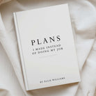 A hardcover book titled 'PLANS: I MADE INSTEAD OF DOING MY JOB' by Ellie Williams, placed on draped cream-colored fabric.