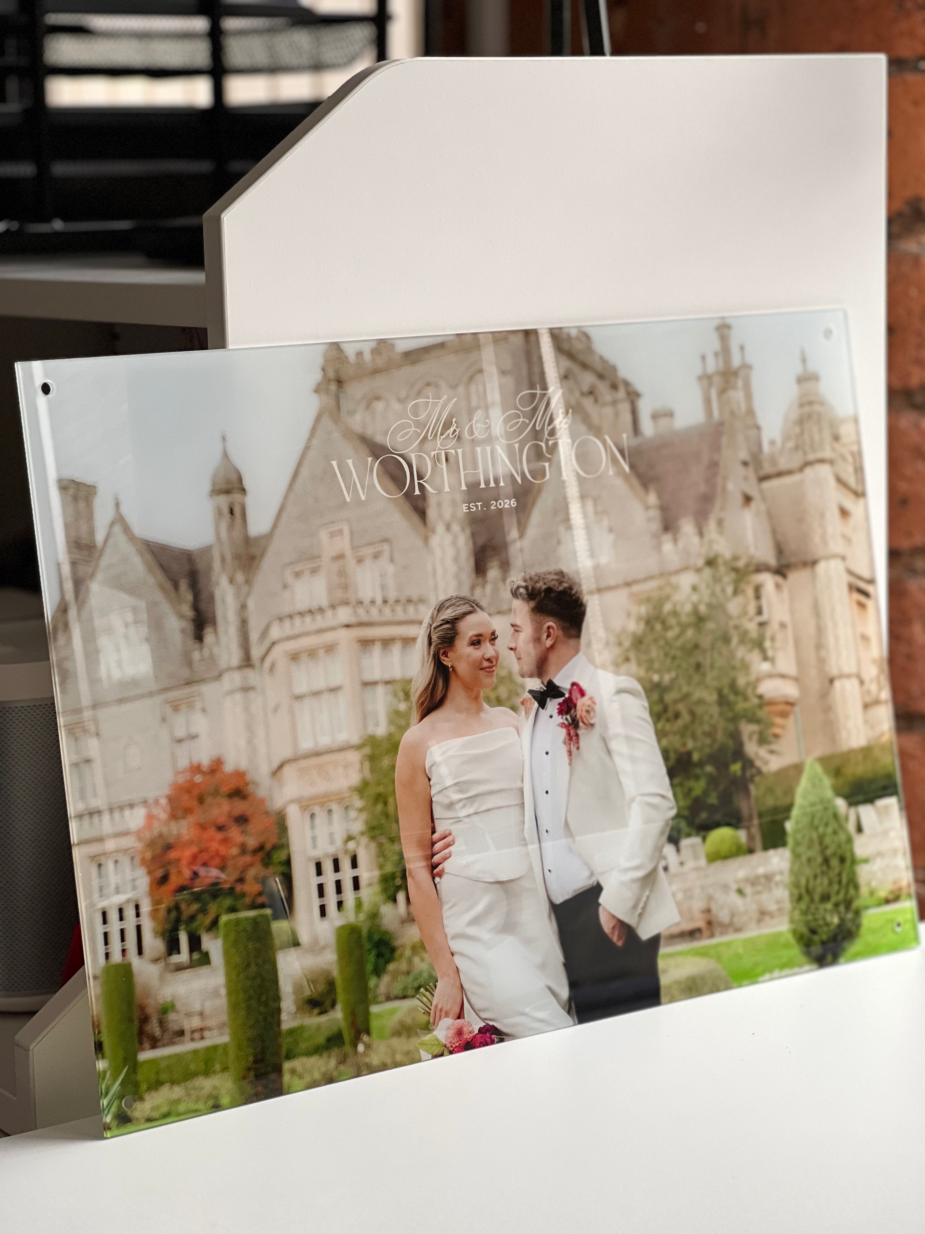 Printed wedding photo on acrylic with a couple in front of a large building