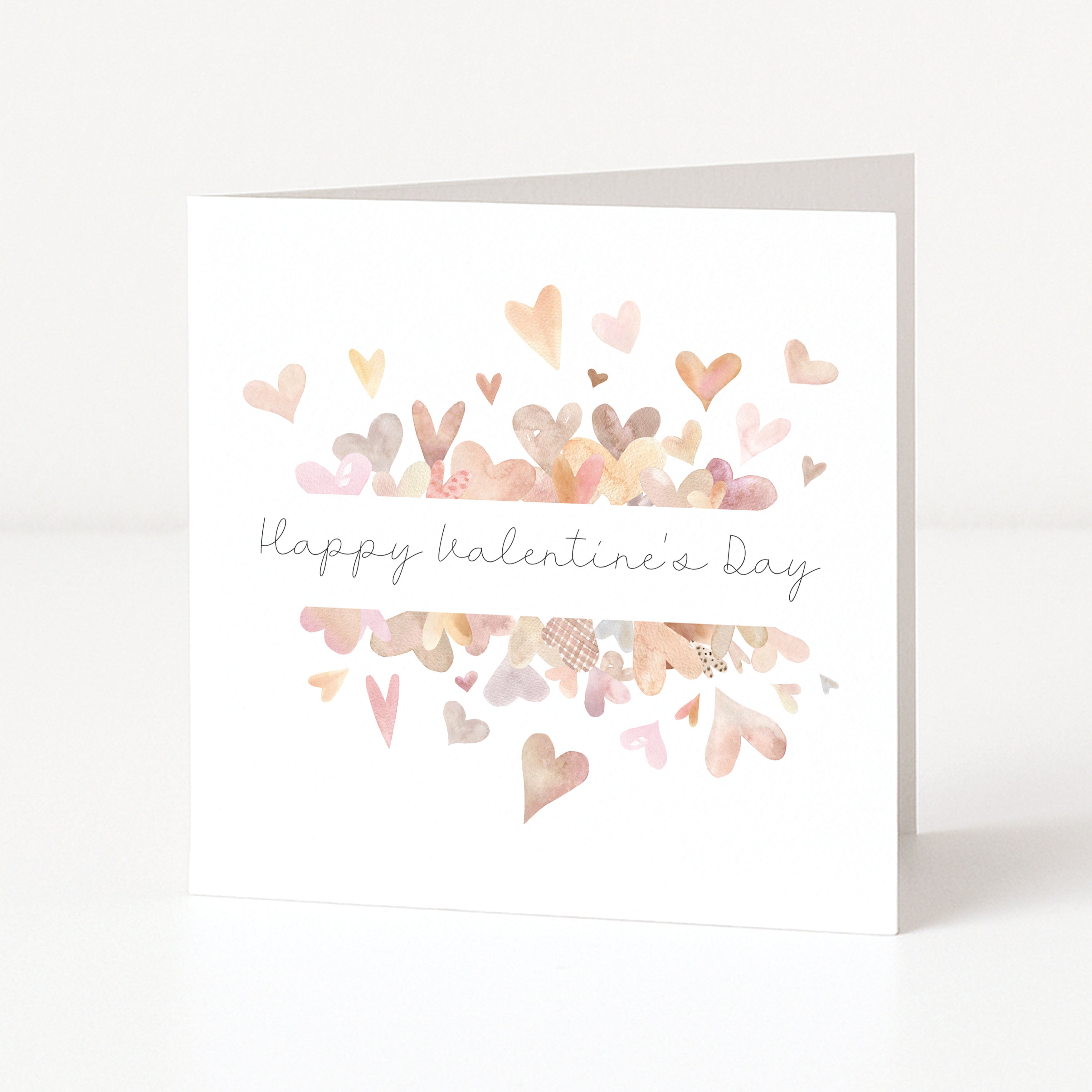 Greeting card with colorful heart shapes and 'Happy Valentine's Day' text on a white background