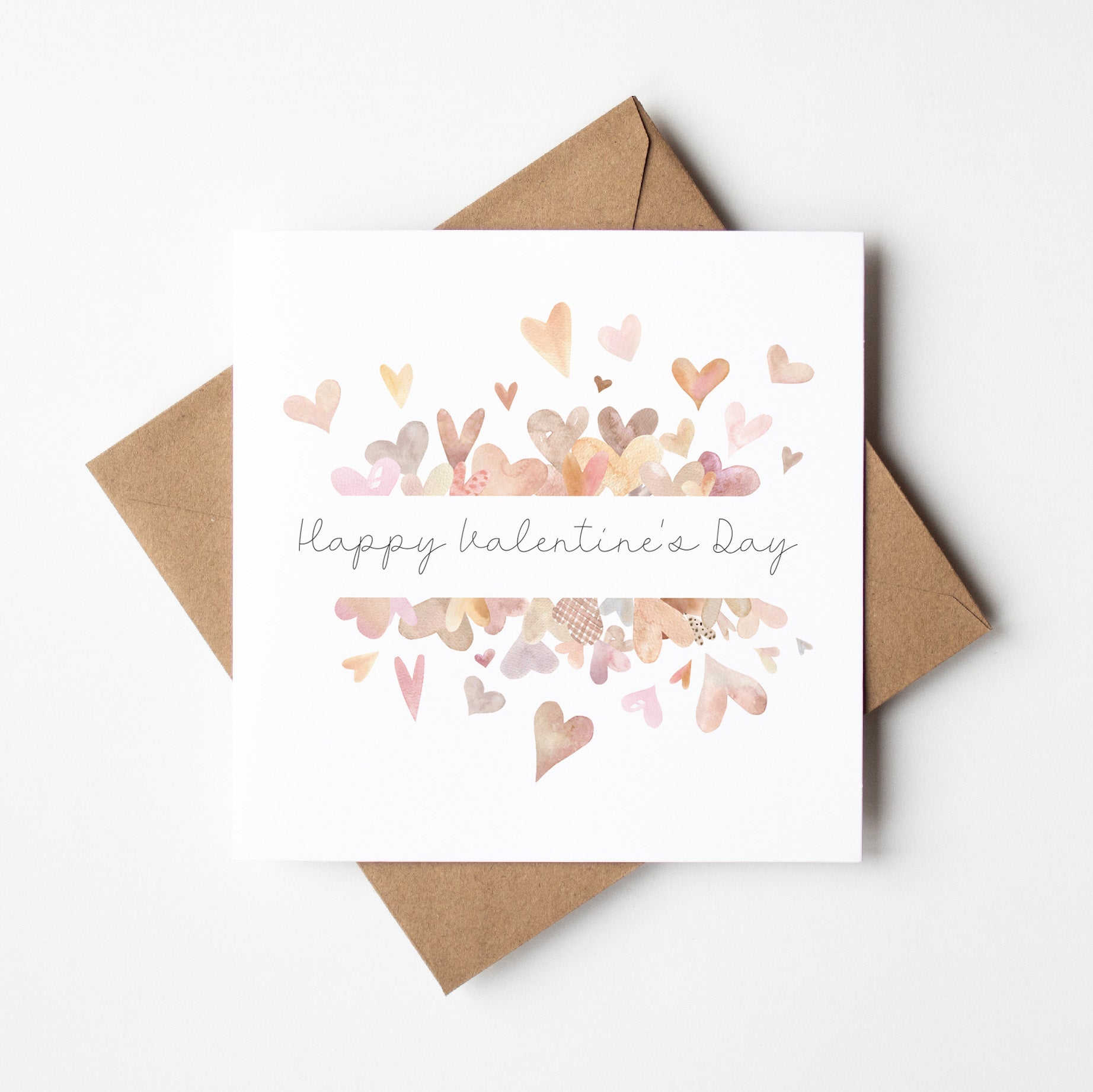 Valentine's Day card with heart designs and 'Happy Valentine's Day' text, accompanied by a brown envelope on a white background.