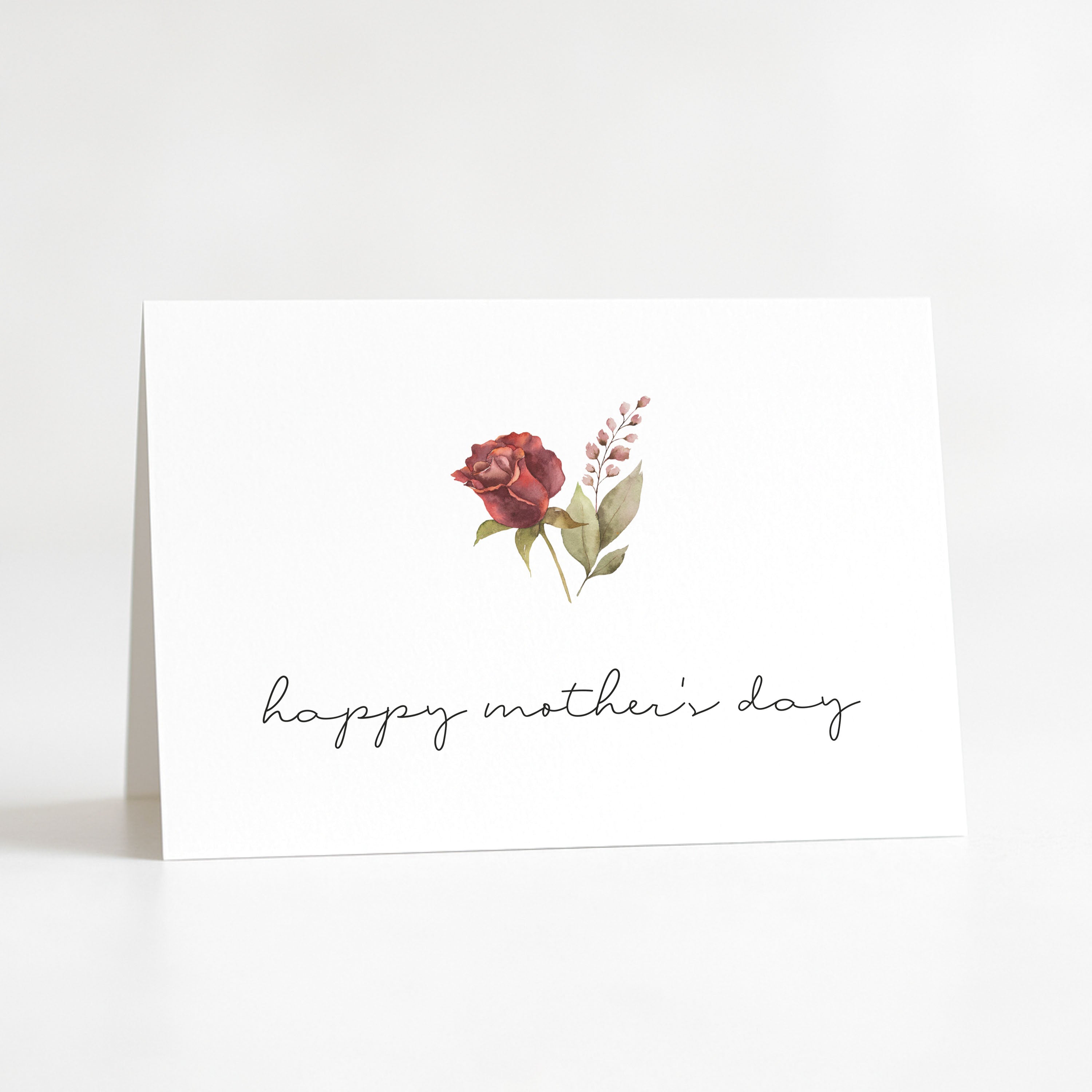 Greeting card with floral design and 'happy mother's day' text on a white background