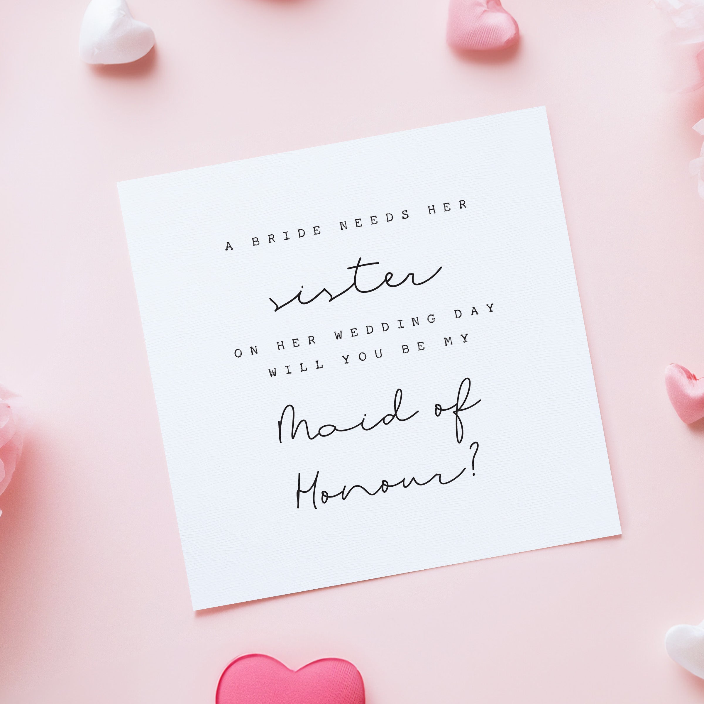 Card asking if a sister will be the maid of honor on a pink background