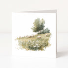 Greeting card with a scenic illustration of sheep in a field on a white background