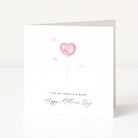 Greeting card with pink heart balloon and 'Happy Mother's Day' text on a white background