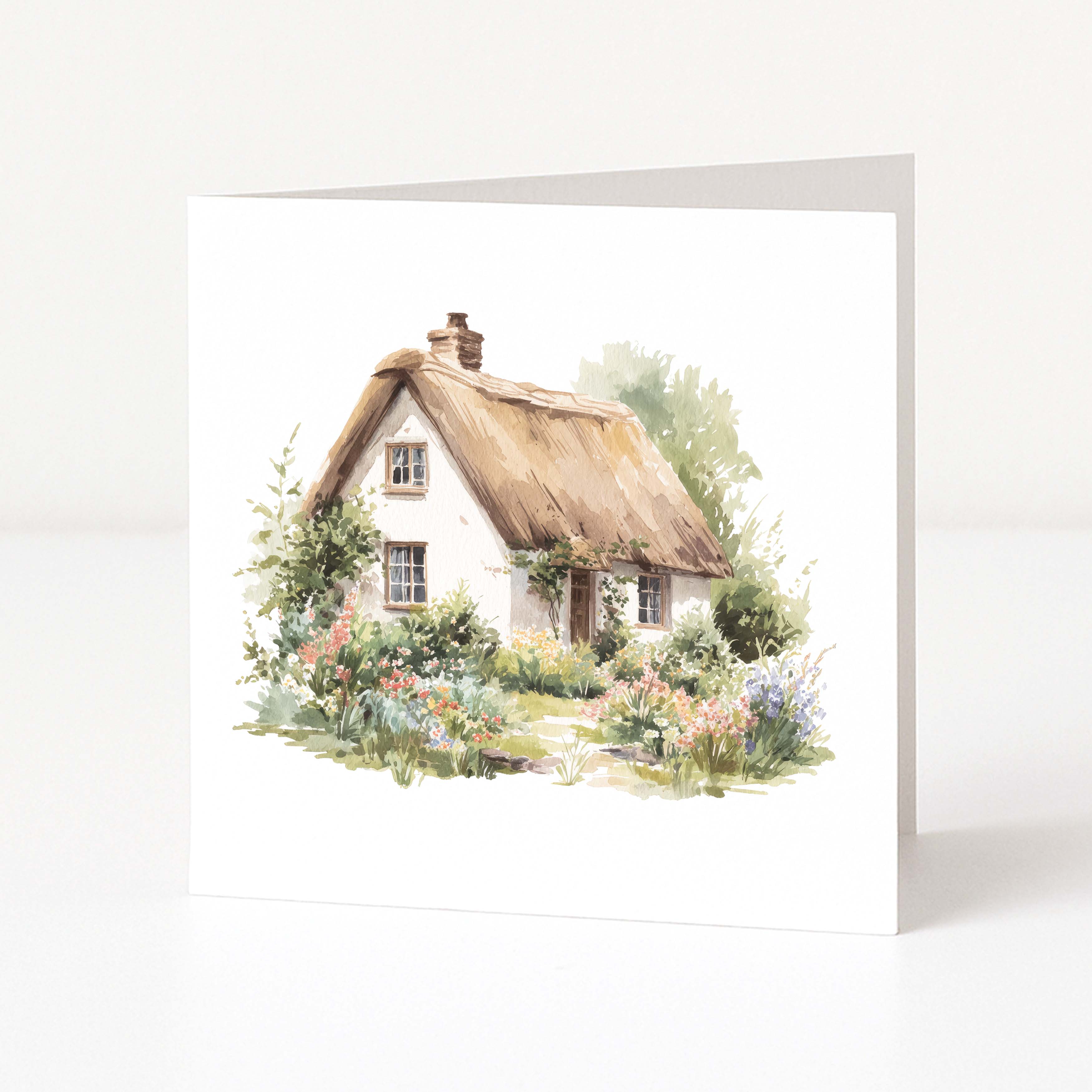 Greeting card with a watercolor illustration of a thatched cottage and garden on a white background