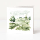 Watercolor landscape painting of a green field with trees on a white background