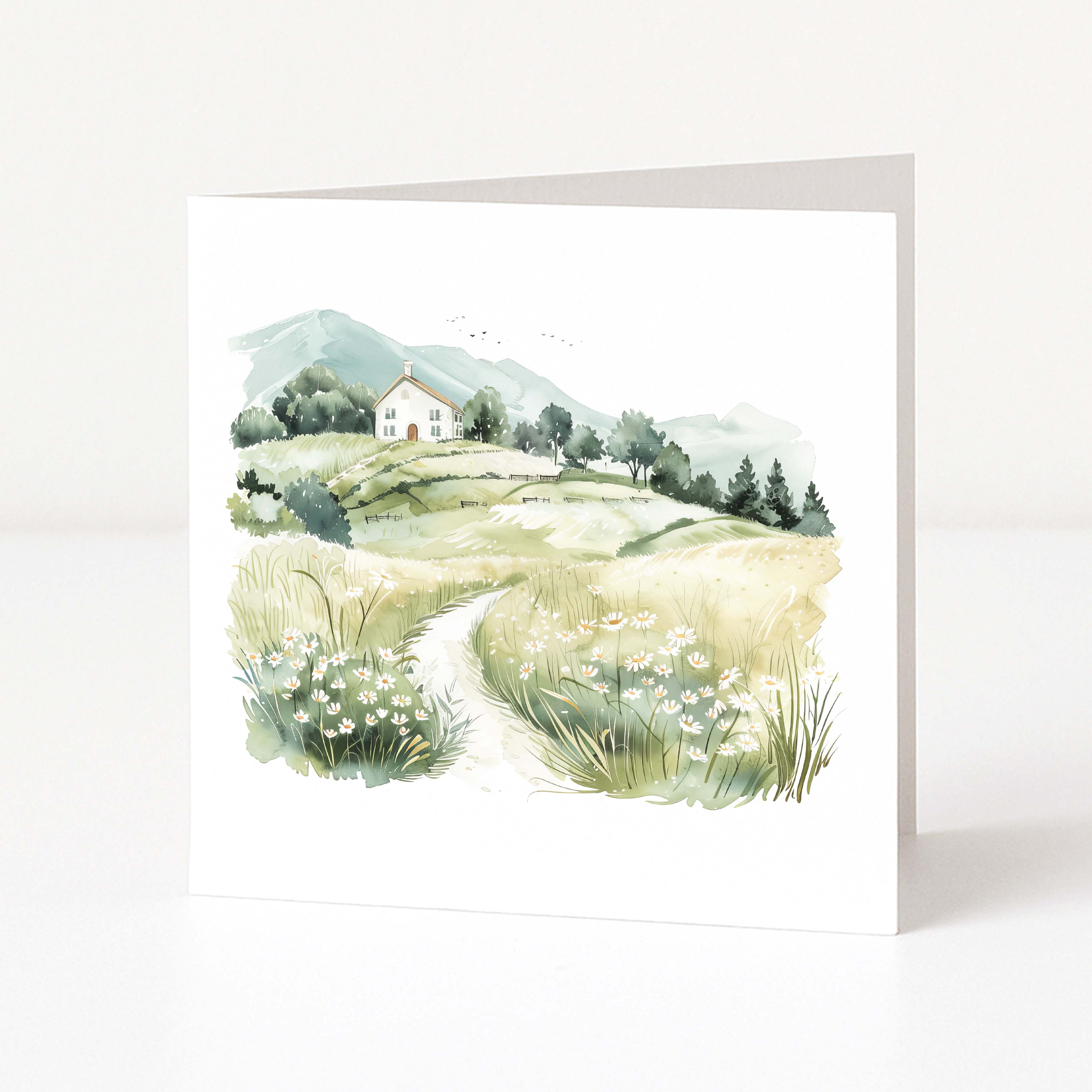 Greeting card with a scenic illustration of a house on a hillside.