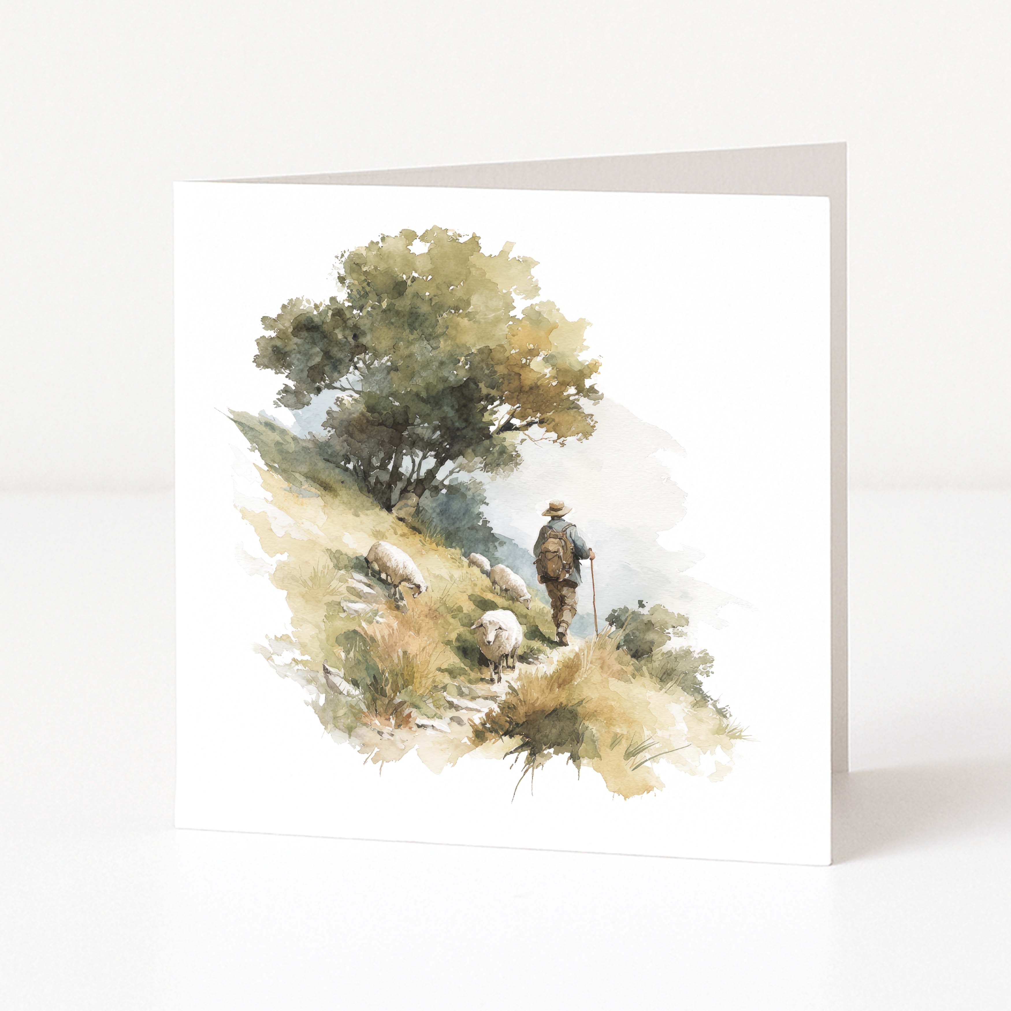 Greeting card with a watercolour design of a shepherd and sheep in a forest on a white background