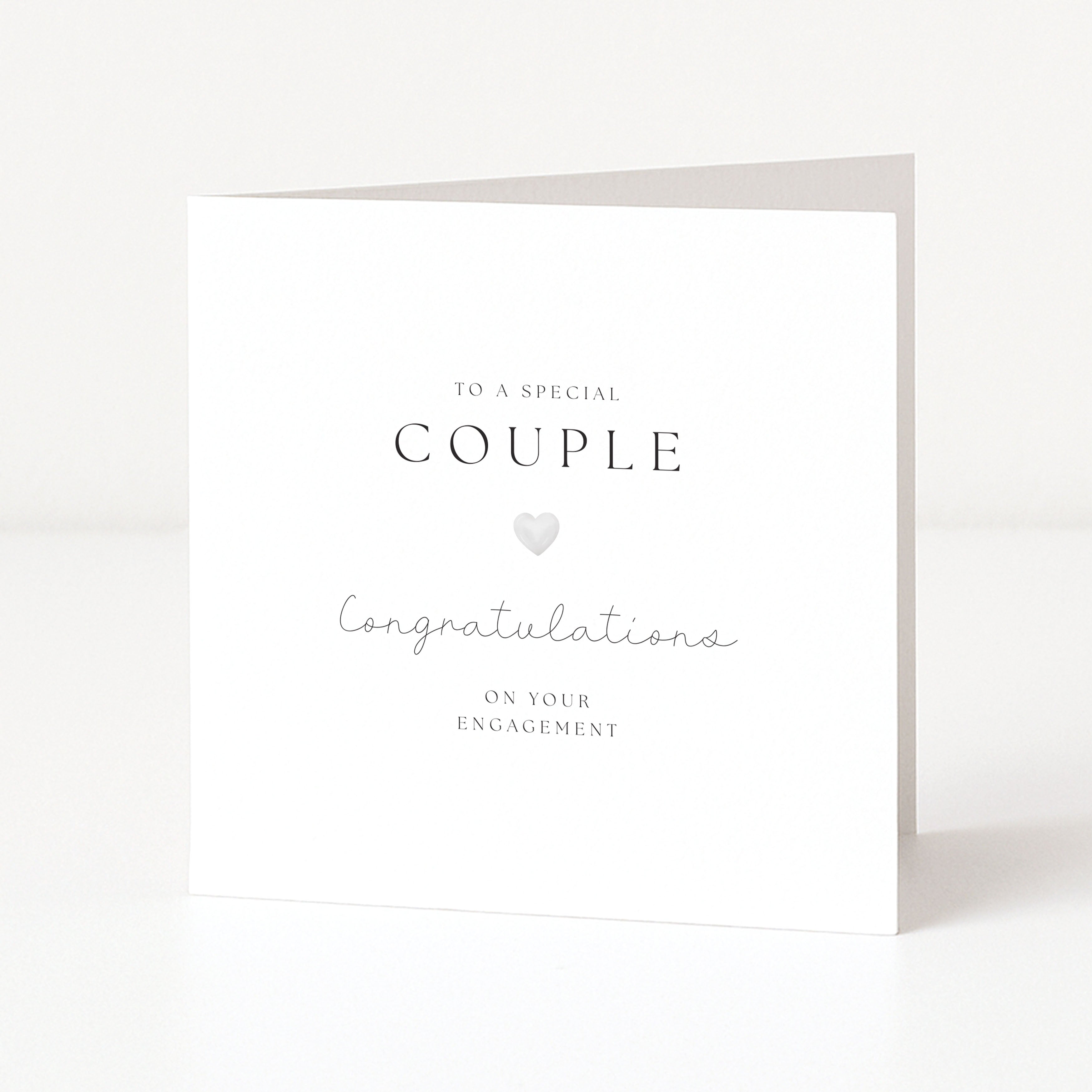 engagement card featuring easy to read font and silver heart. On a white background. 