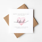Valentine's Day card for an amazing husband with a pink heart and brown envelope on a white background